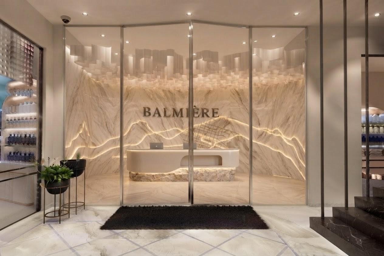The glass-fronted arrival view into the Balmière reception